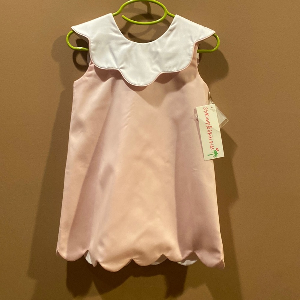 Shrimp&Grits scalloped dress. Bow in back with buttons down back.